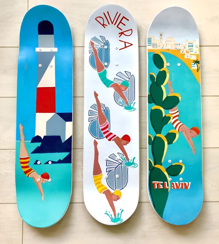 Three painted skateboard decks featuring vintage-style beach and diving scenes are arranged vertically to create a colorful and creative Skateboard Wall Art DIY display for a girl's bedroom.